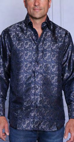 Man wearing the INSOMNIA MZT-212 Woven Satin Charcoal Shirt by Insomnia and blue jeans, standing in front of a light-colored wall.