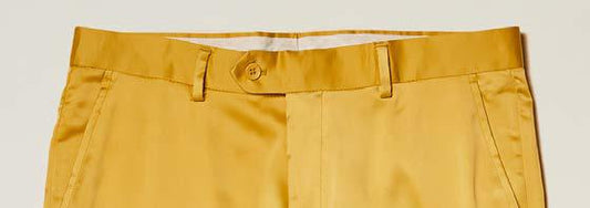 Inserch Stretch Satin Pants P3901-00038 Gold by Inserch, featuring a slim fit in gold with belt loops, a button closure, and zip fly, shown from the waistband to mid-thigh against a plain background.