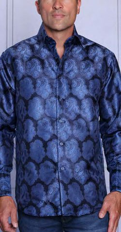A man wears the Insomnia MZT-208 Woven Satin Midnight Shirt, a long-sleeve button-up by Insomnia with a shiny blue and black floral pattern and French cuffs, standing against a light background.