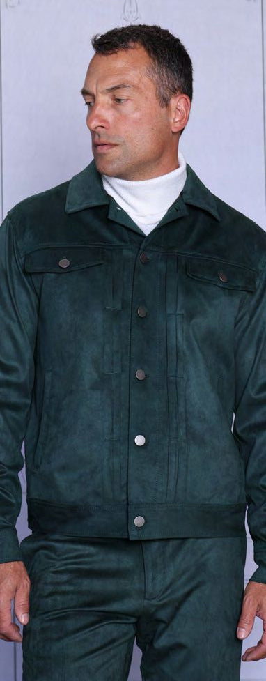 A man models the INSOMNIA ROMEO 2PC Vegan PU Suede Casual Jacket & Pants Hunter Set by Insomnia, featuring a dark green ensemble over a white turtleneck, standing slightly turned to the side.