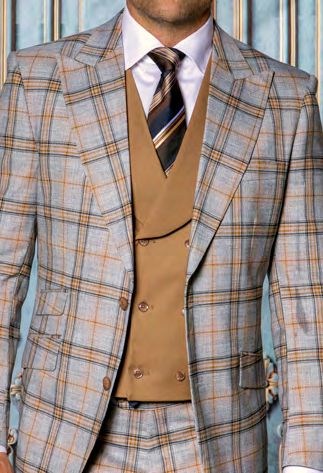 A man wearing the INSOMNIA PARIS-5 3PC Compose Tailored Fit Copper Suit by Insomnia, featuring a tailored copper jacket and pants, a matching vest, paired with a white dress shirt and striped tie.