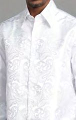 A person wearing the Manzini MANZINI MZT-100 Paisley Long Sleeve Satin White Shirt w/ Links; only the torso and part of the face are visible—ideal for formal events.