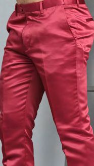 A person wearing MANZINI MP-400 Burgundy Satin Pants by Manzini, featuring belt loops and pockets, stands against a neutral background.