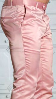 A person is wearing Manzini MANZINI MP-400 Rose Gold Satin Pants with belt loops, standing in front of a white background.
