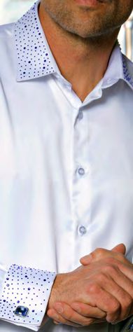 A man wears the Insomnia INSOMNIA IN-118 Slim Fit Satin Stone Collar & Cuff White Royal Shirt, featuring blue dotted pattern on collar and cuffs, hands clasped in front.