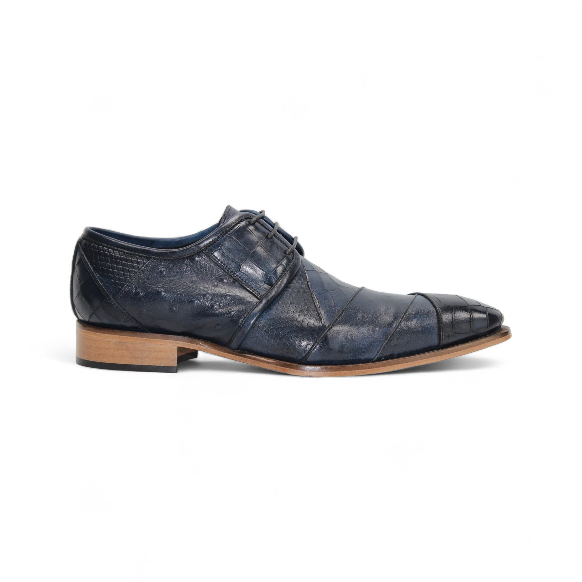 The Duca Imperio Ocean Blue by Duca Di Matiste is a single Italian-made, dark blue textured leather dress shoe with a pointed toe and light brown sole, shown in profile on a white background.