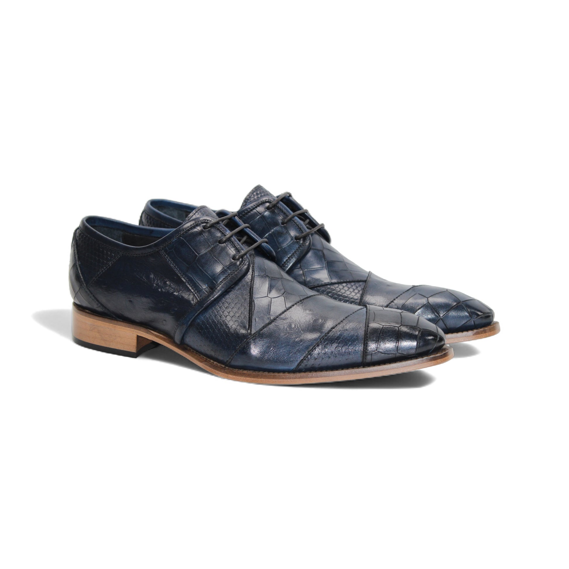 The Duca Imperio Ocean Blue by Duca Di Matiste is a single Italian-made, dark blue textured leather dress shoe with a pointed toe and light brown sole, shown in profile on a white background.