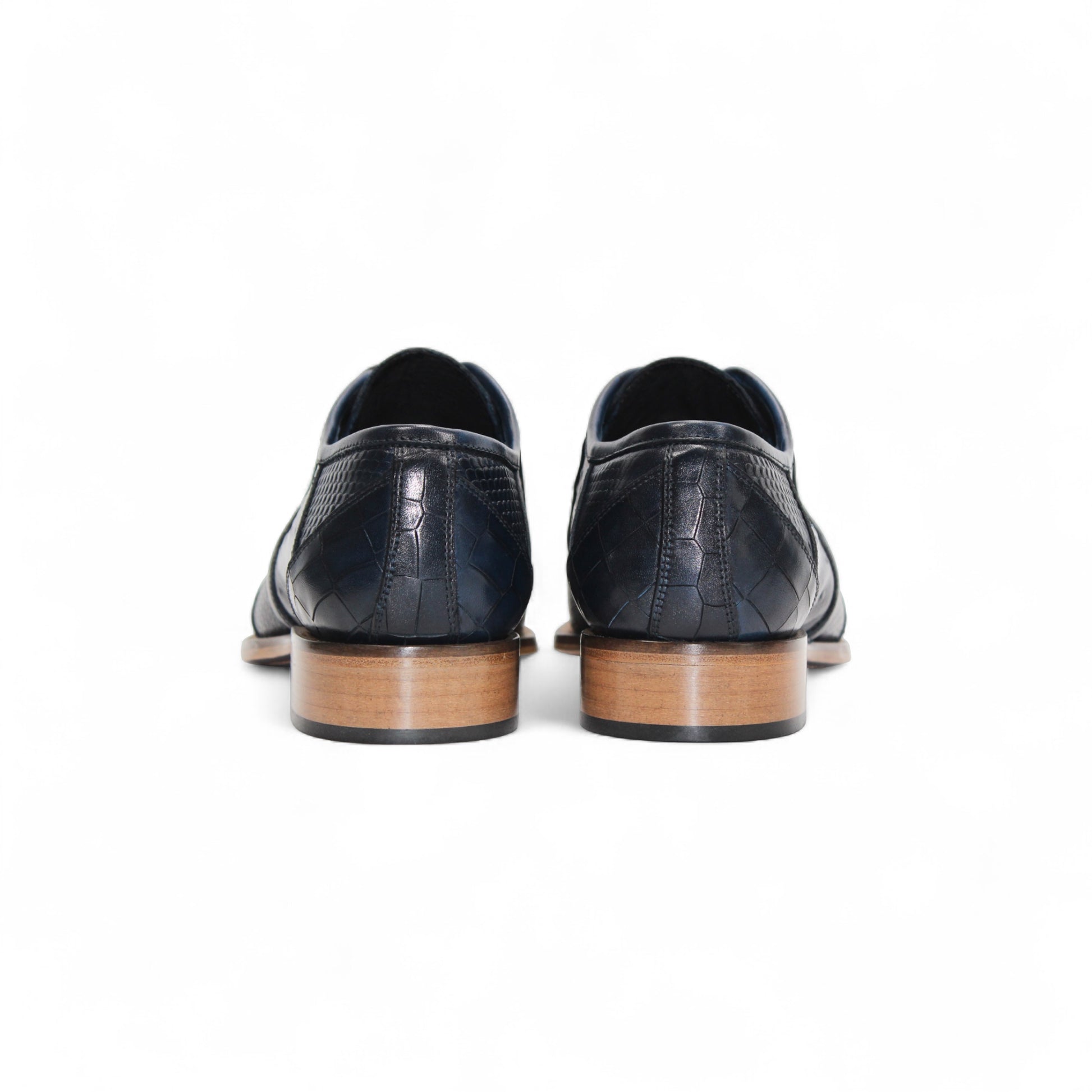 The Duca Imperio Ocean Blue by Duca Di Matiste is a single Italian-made, dark blue textured leather dress shoe with a pointed toe and light brown sole, shown in profile on a white background.