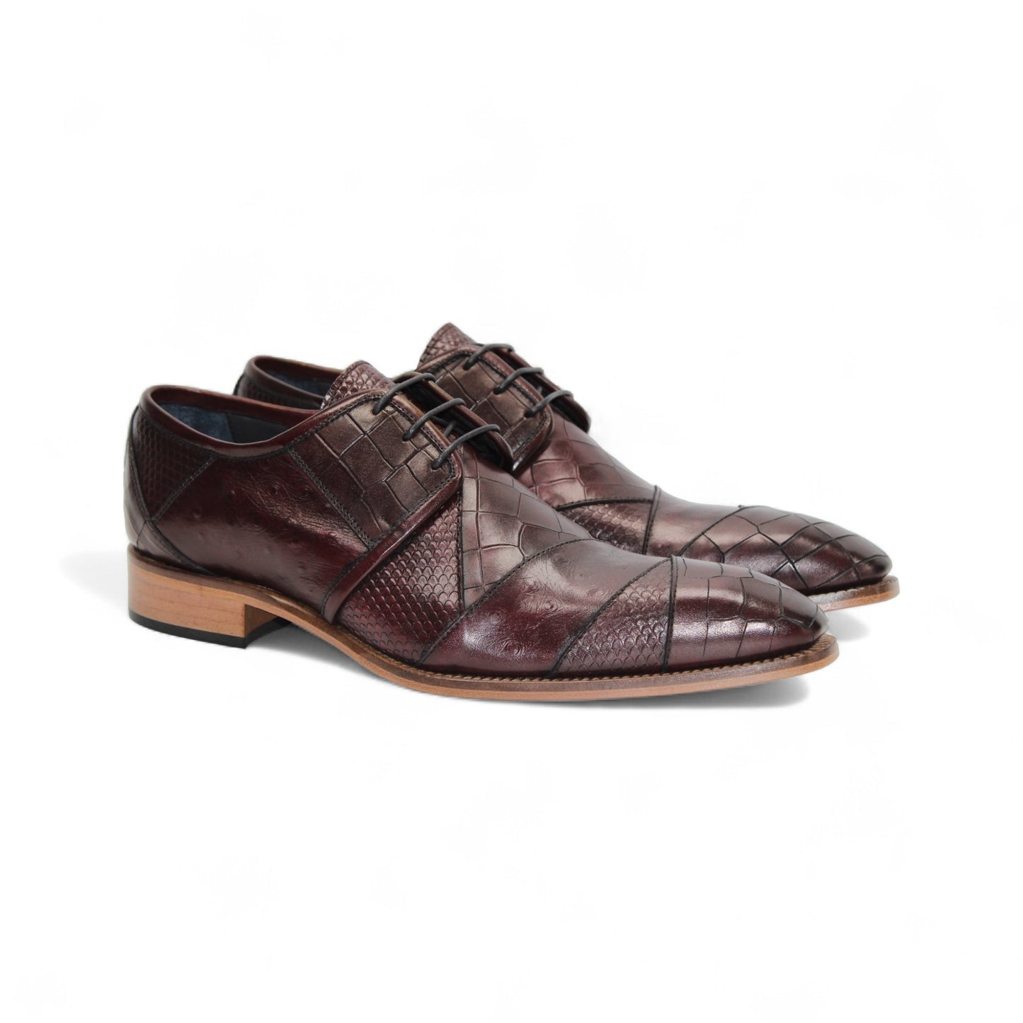 The Duca Imperio Burgundy by Duca Di Matiste is a single genuine leather dress shoe in brown, featuring a textured design and light brown sole, displayed in profile against a white background for timeless style and comfort.