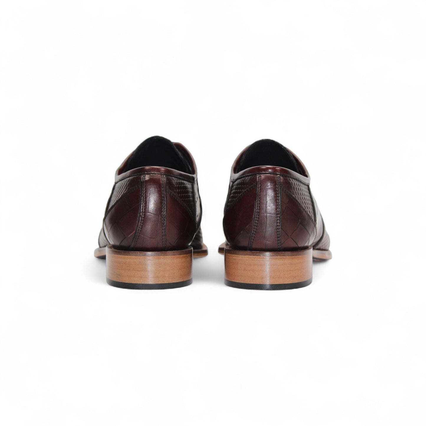 The Duca Imperio Burgundy by Duca Di Matiste is a single genuine leather dress shoe in brown, featuring a textured design and light brown sole, displayed in profile against a white background for timeless style and comfort.