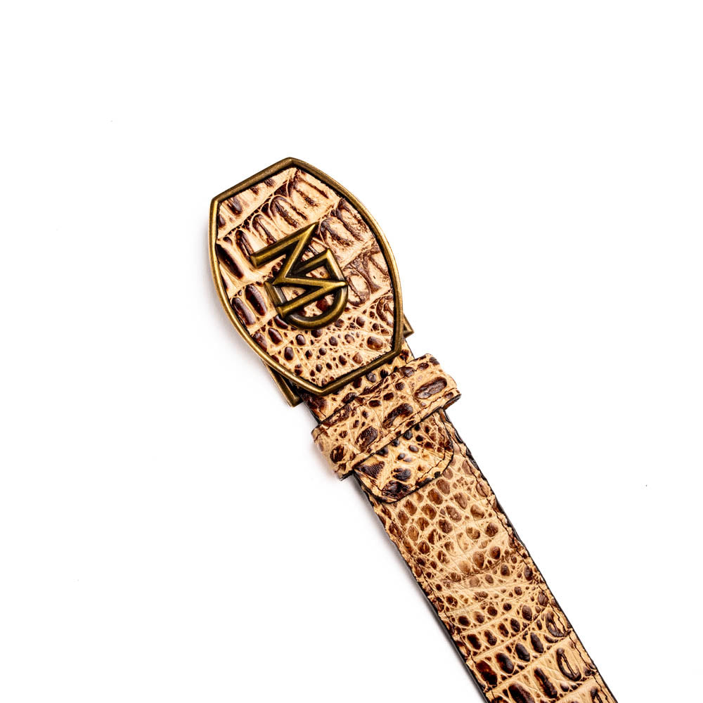 The Iowa Belt Stone Orix by Marco Di Milano features brown genuine crocodile leather, a gold "MD" buckle, and "Marco Di Milano" branding on the strap.