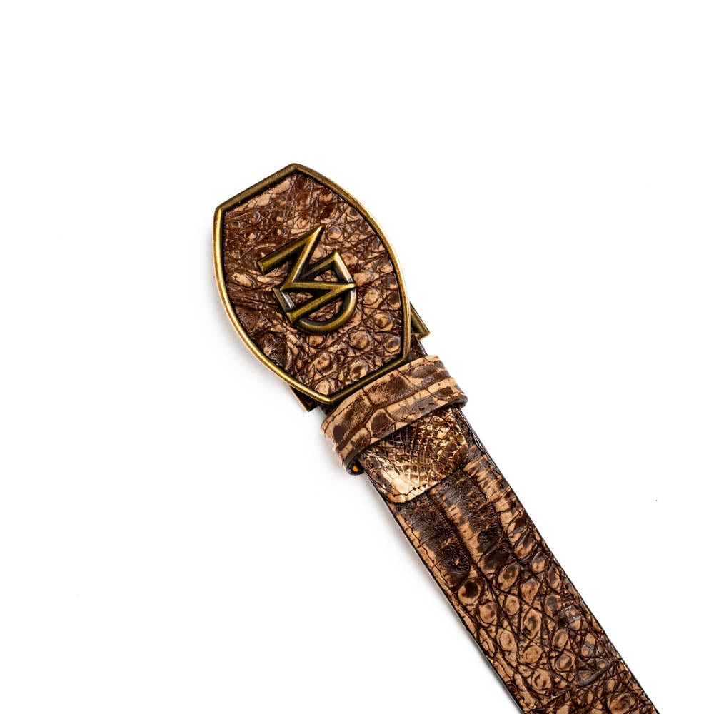 The Marco Di Milano Iowa Belt Stone Brown features genuine caiman crocodile leather, a gold "MD" buckle, and "Marco Milano" engraved on the side, evoking a classic western style against a white background.