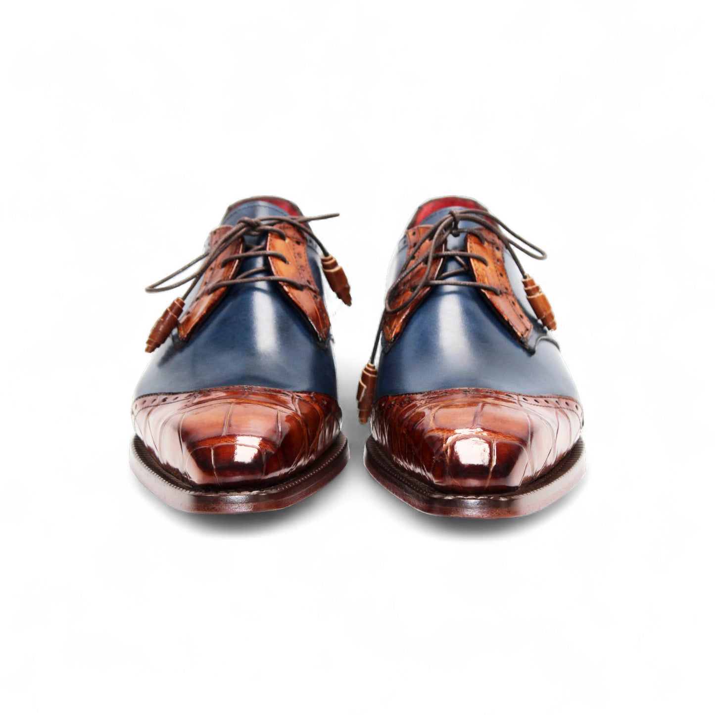 The Fennix Jax Cognac/Navy by Fennix of Italy is a luxury men's dress shoe with a blue leather upper, brown leather toe and heel accents, brogue details, brown laces, and Italian craftsmanship, shown in profile on a plain white background.