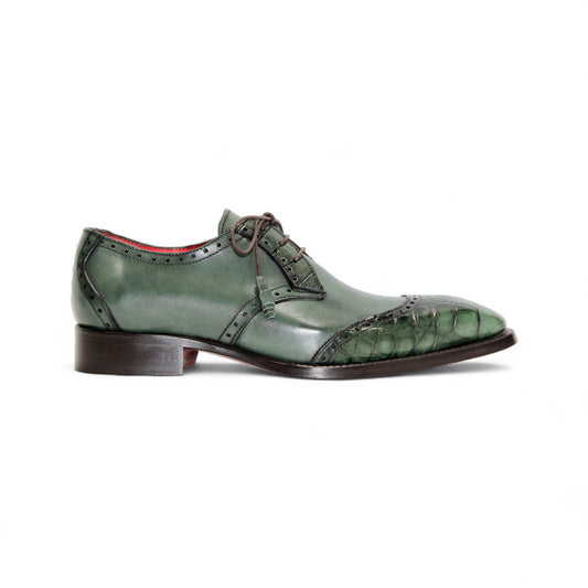 The Fennix Jax Green by Fennix of Italy is a green luxury leather dress shoe with brogued detailing, laces, and a low wooden heel, reflecting Italian craftsmanship and shown in profile against a white background.