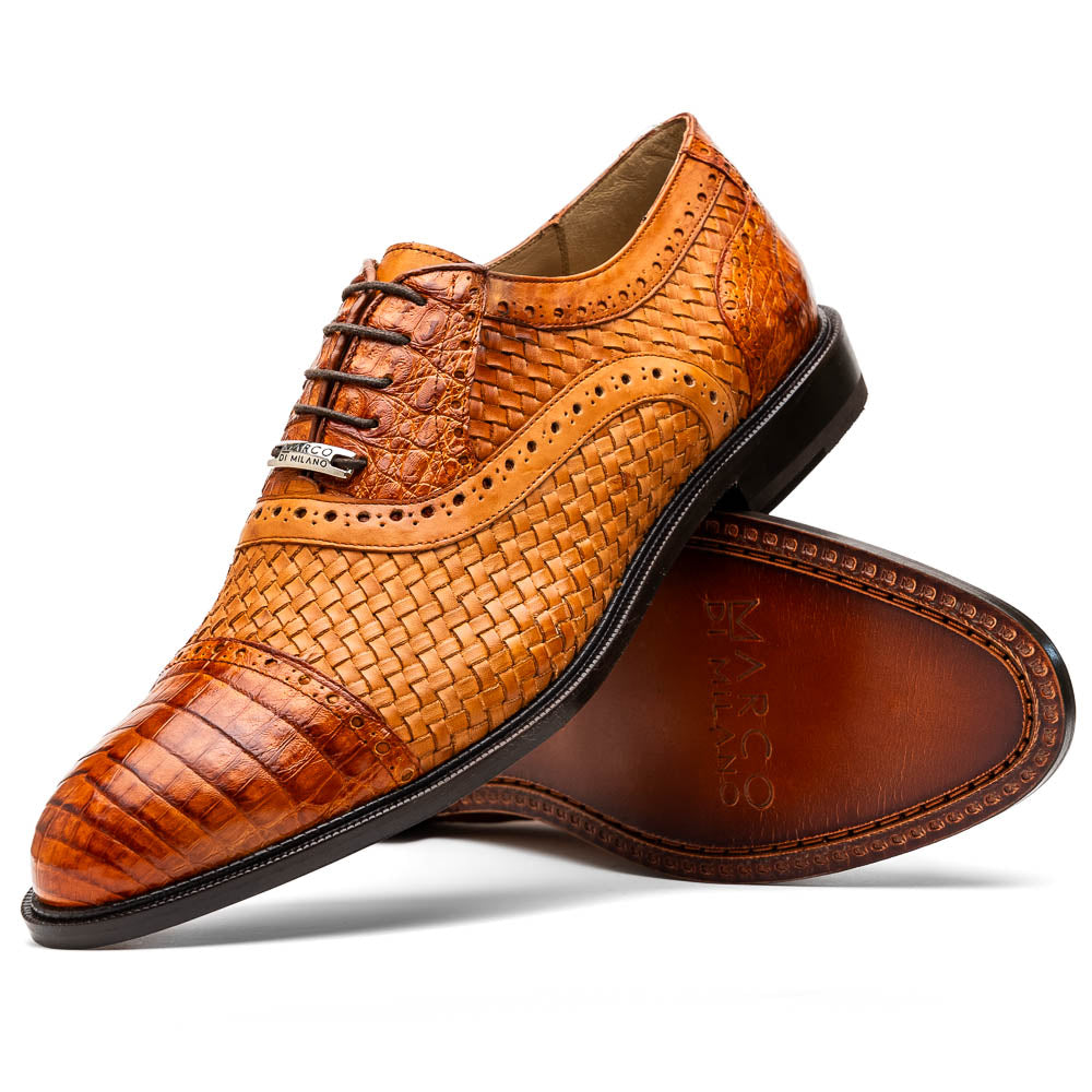 The John Brandy by Marco Di Milano is a pair of brown men’s oxford dress shoes with woven and textured leather, black laces, and stitched leather soles—ideal for those seeking luxury footwear.