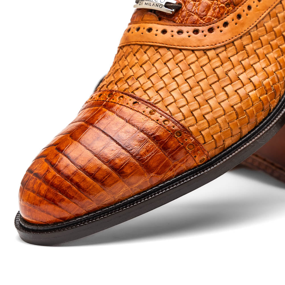 The John Brandy by Marco Di Milano is a pair of brown men’s oxford dress shoes with woven and textured leather, black laces, and stitched leather soles—ideal for those seeking luxury footwear.