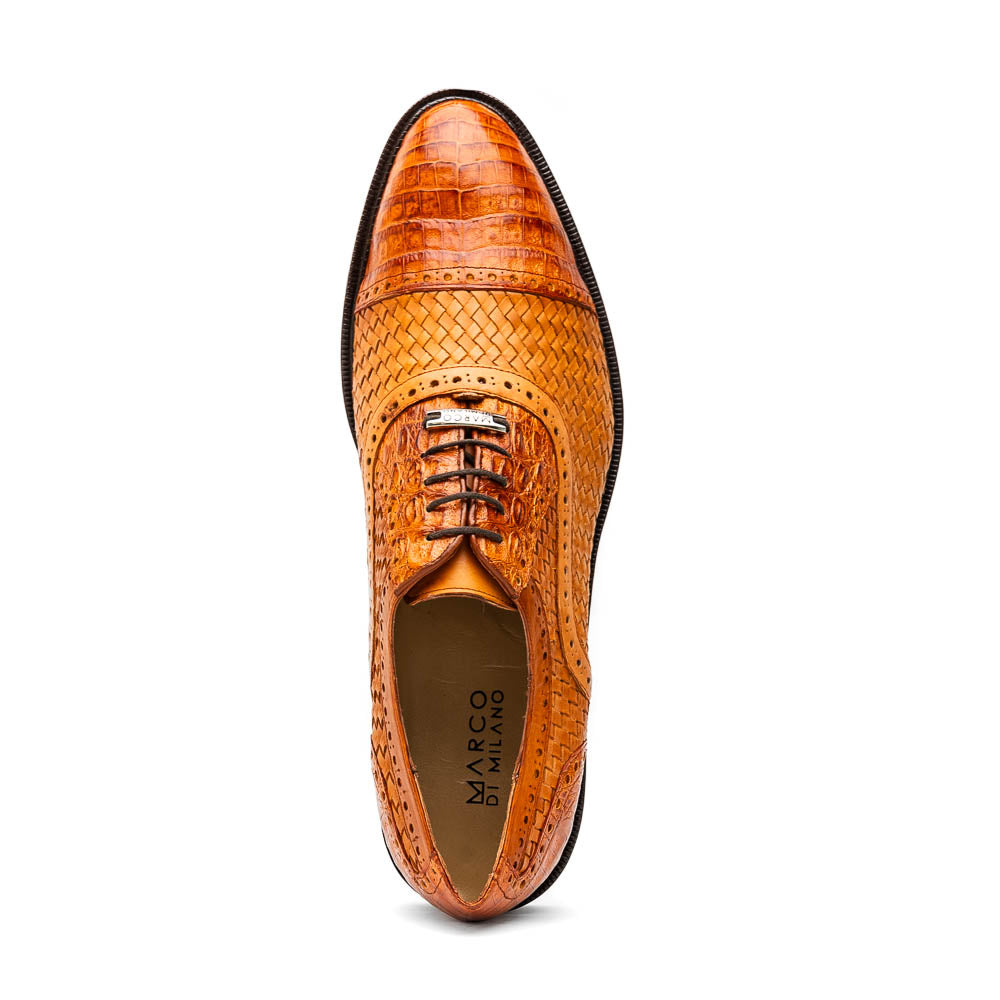 The John Brandy by Marco Di Milano is a pair of brown men’s oxford dress shoes with woven and textured leather, black laces, and stitched leather soles—ideal for those seeking luxury footwear.