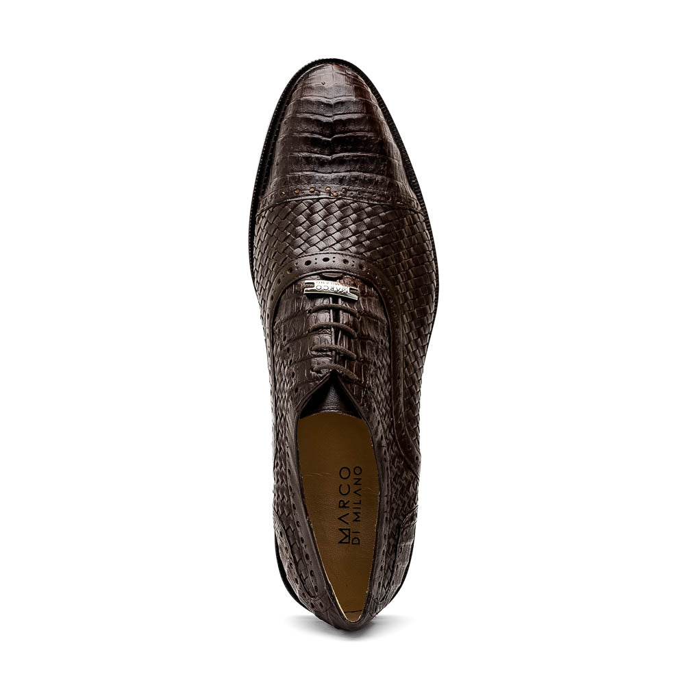 A pair of John Brown luxury dress oxfords by Marco Di Milano in brown woven calfskin leather with brogue detailing; one shoe upright, the other displays the sole and "Marco Di Milano" branding.