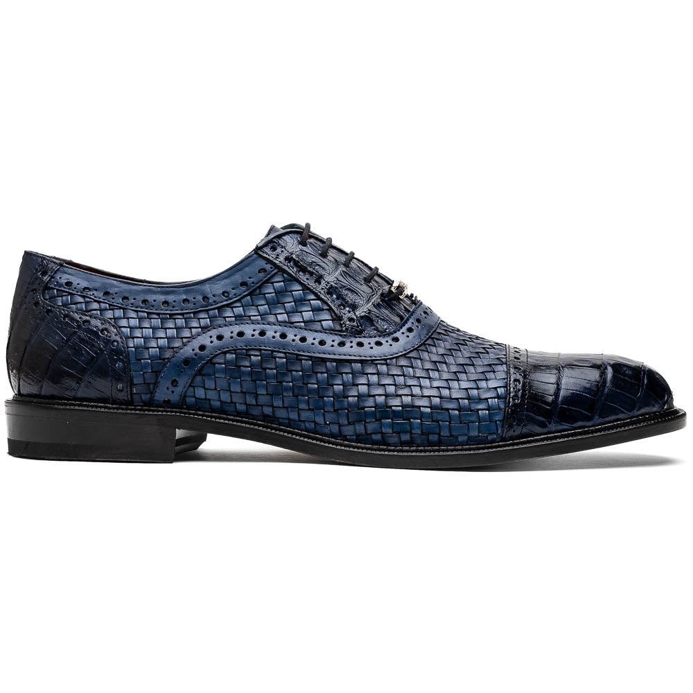 Introducing the Marco Di Milano John Navy: luxury dark blue woven oxford shoes in genuine caiman crocodile leather, with one shoe showing the sole and the other upright.