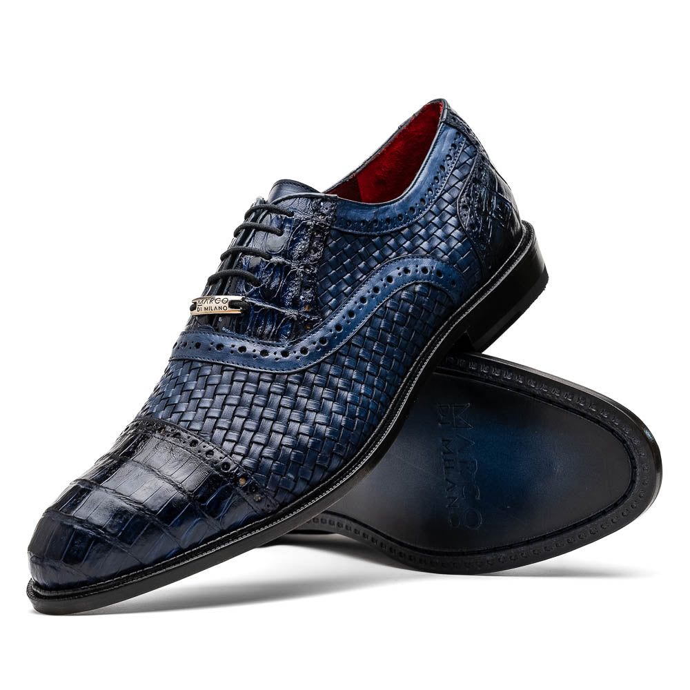 Introducing the Marco Di Milano John Navy: luxury dark blue woven oxford shoes in genuine caiman crocodile leather, with one shoe showing the sole and the other upright.