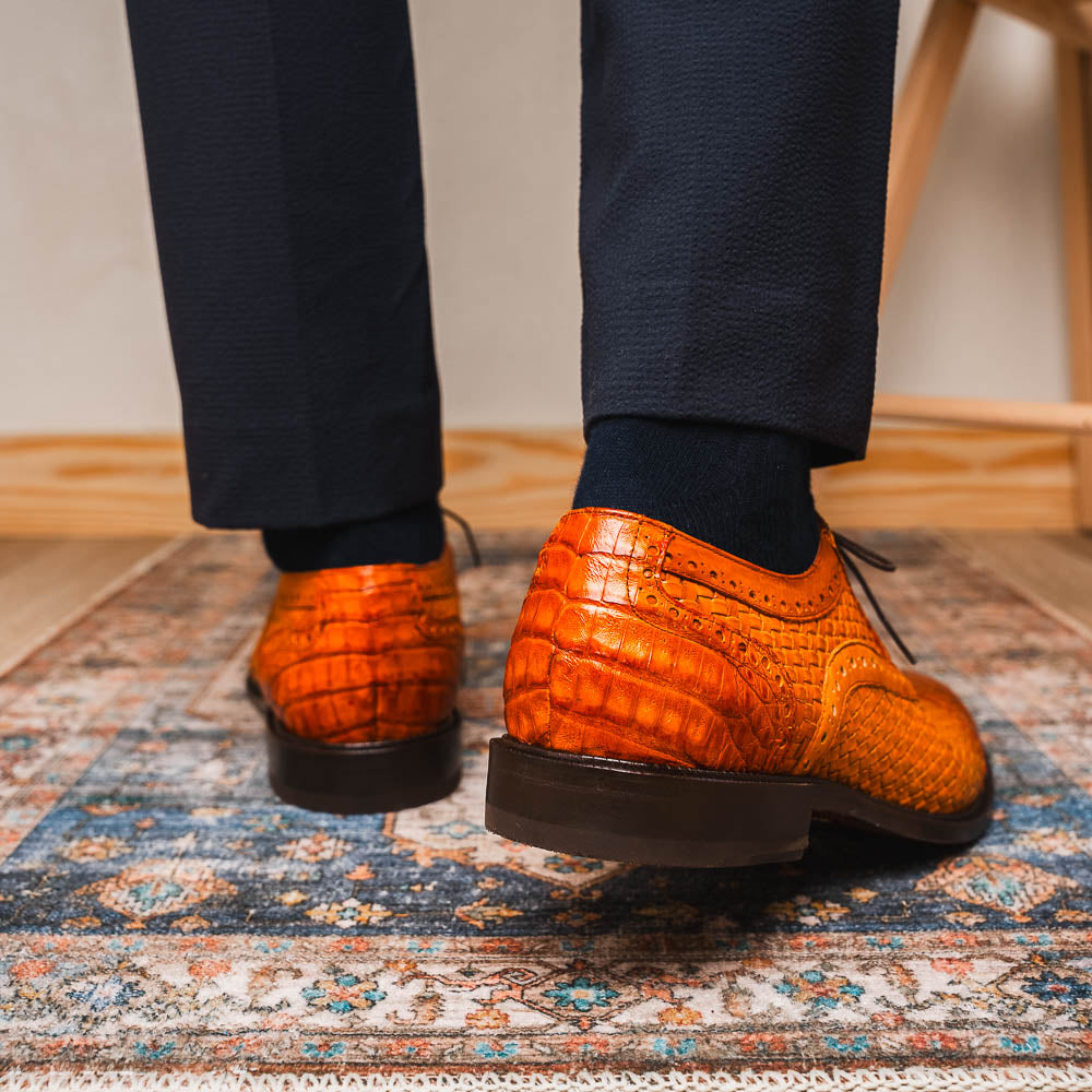 The John Brandy by Marco Di Milano is a pair of brown men’s oxford dress shoes with woven and textured leather, black laces, and stitched leather soles—ideal for those seeking luxury footwear.