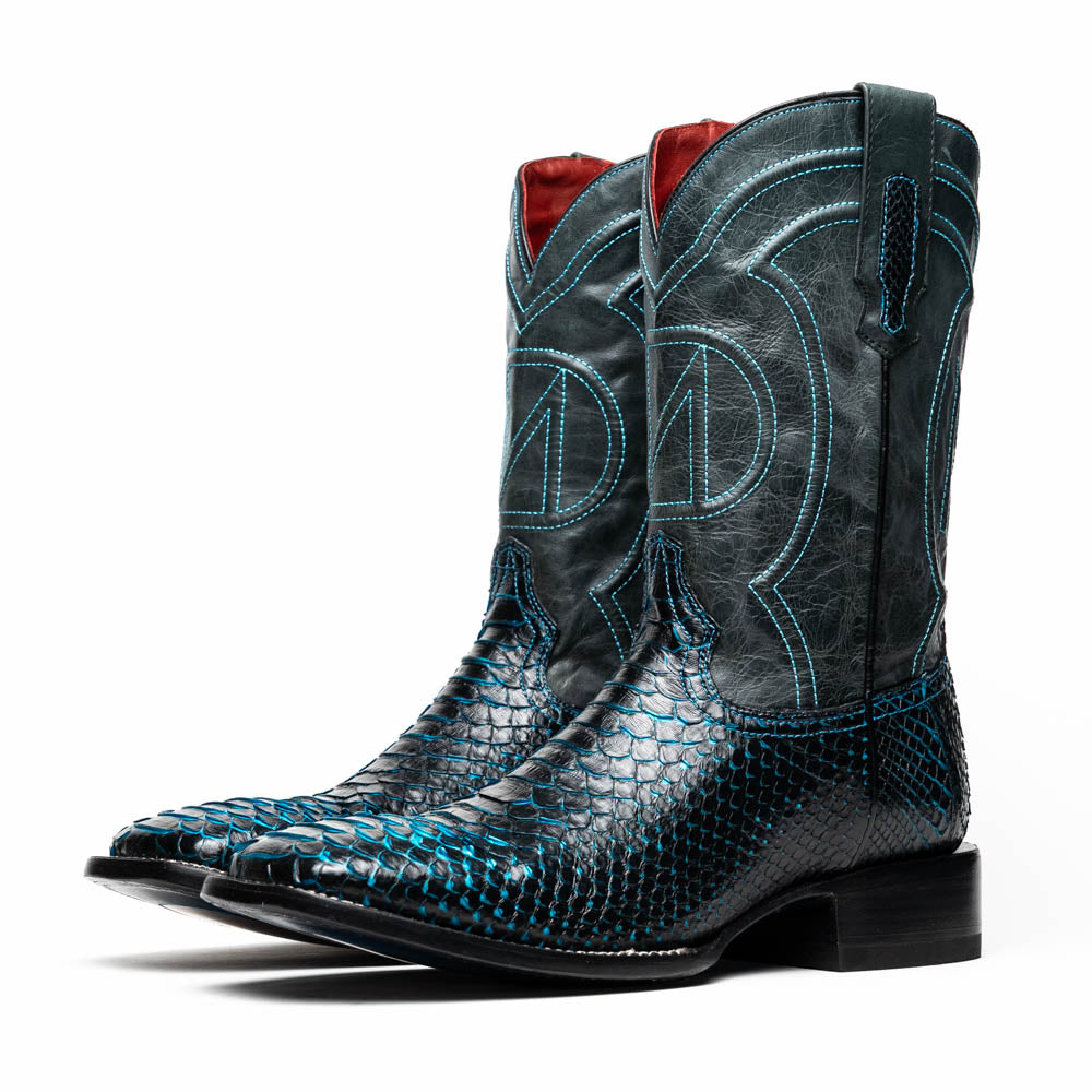 The Marco Di Milano Kansas Black / Blue boots feature black leather with blue stitching, a snakeskin texture, and branded soles—a luxurious handcrafted pair designed to stand out.