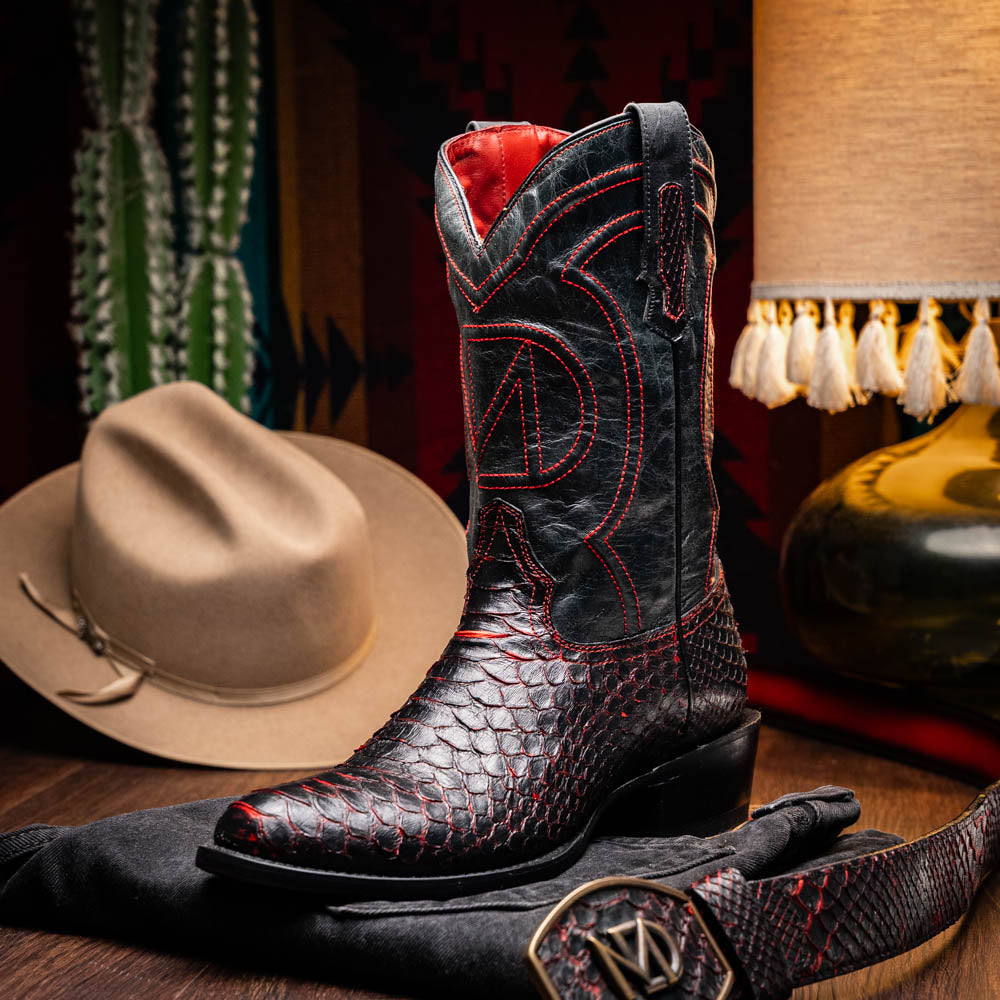 The Kansas BlackCherry boots by Marco Di Milano feature black and red textured python scales, red stitching, and branded soles—crafted as genuine python western boots for a bold statement.