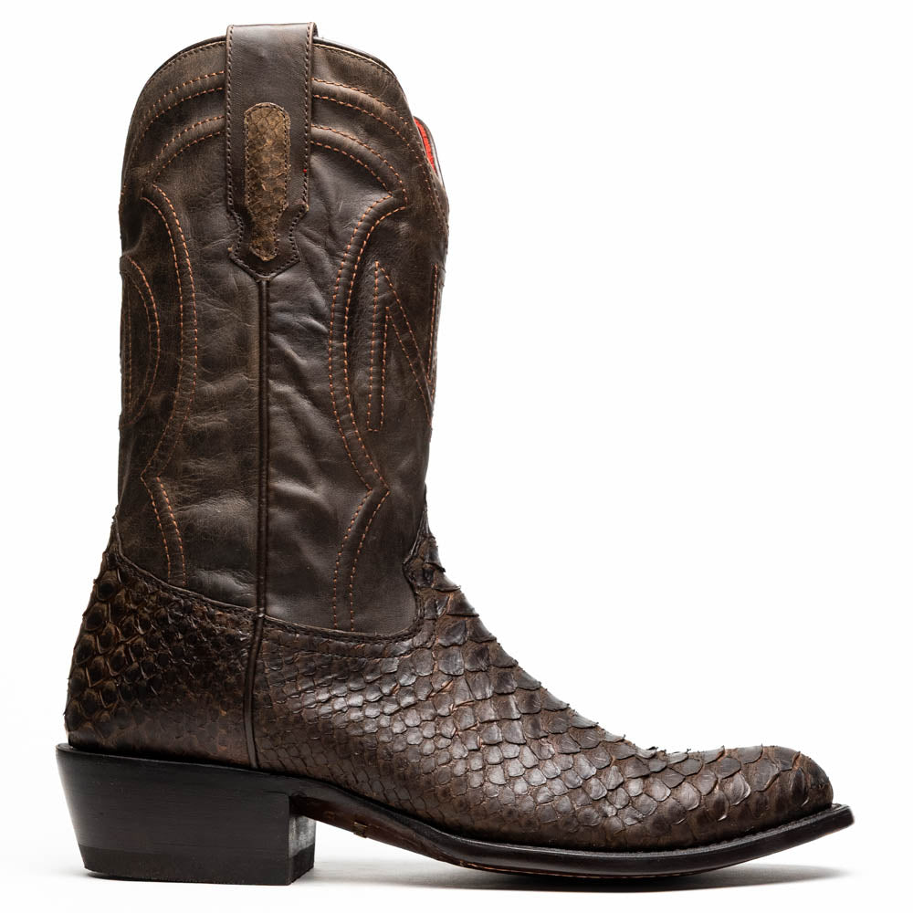A pair of Kansas Brown textured luxury western boots by Marco Di Milano, featuring a pointed toe—one boot upright, the other showing the brand's logo on the leather sole.