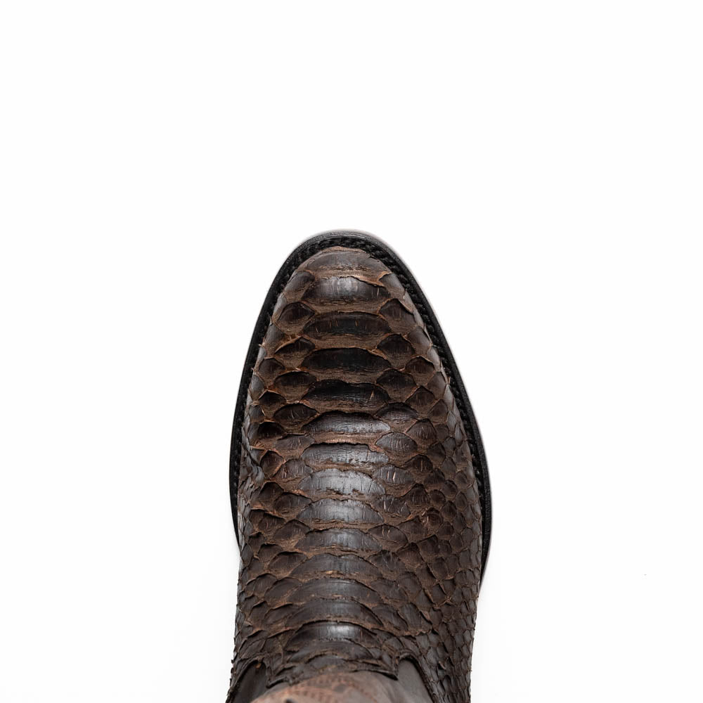 A pair of Kansas Brown textured luxury western boots by Marco Di Milano, featuring a pointed toe—one boot upright, the other showing the brand's logo on the leather sole.