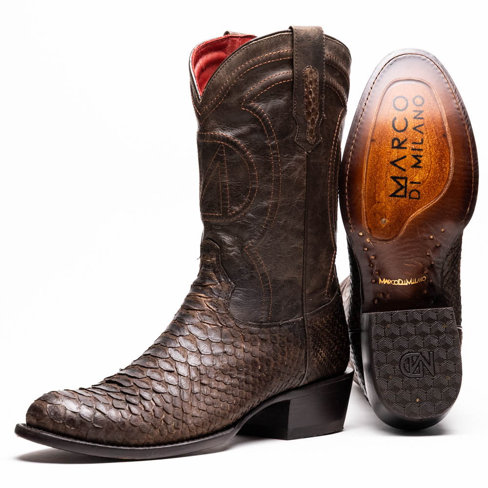 A pair of Kansas Brown textured luxury western boots by Marco Di Milano, featuring a pointed toe—one boot upright, the other showing the brand's logo on the leather sole.