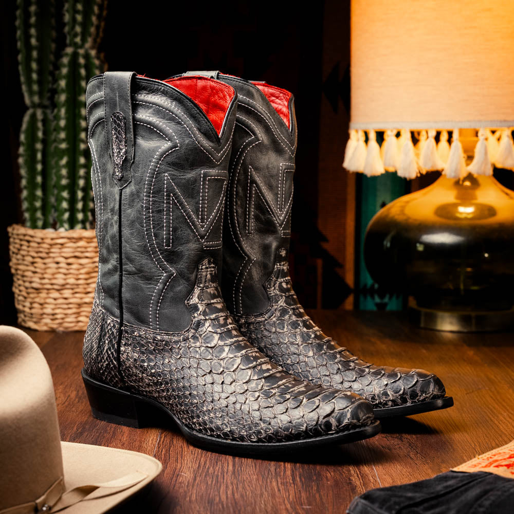 A pair of Kansas Stone White Western cowboy boots by Marco Di Milano, featuring textured, snakeskin-like leather and decorative stitching; one boot stands upright, the other shows the branded sole.