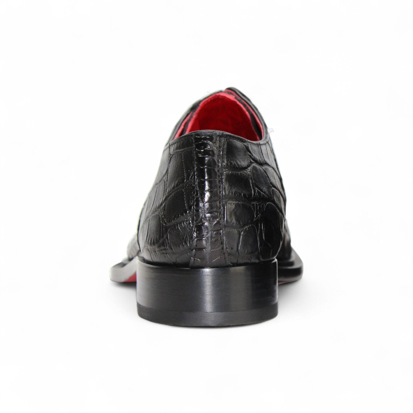 The Fennix Kingston Black by Fennix of Italy is a black dress shoe with a crocodile-patterned finish, pointed toe, red lining, leather sole, and low black heel—exquisitely crafted in Italy and shown in profile against a white background.