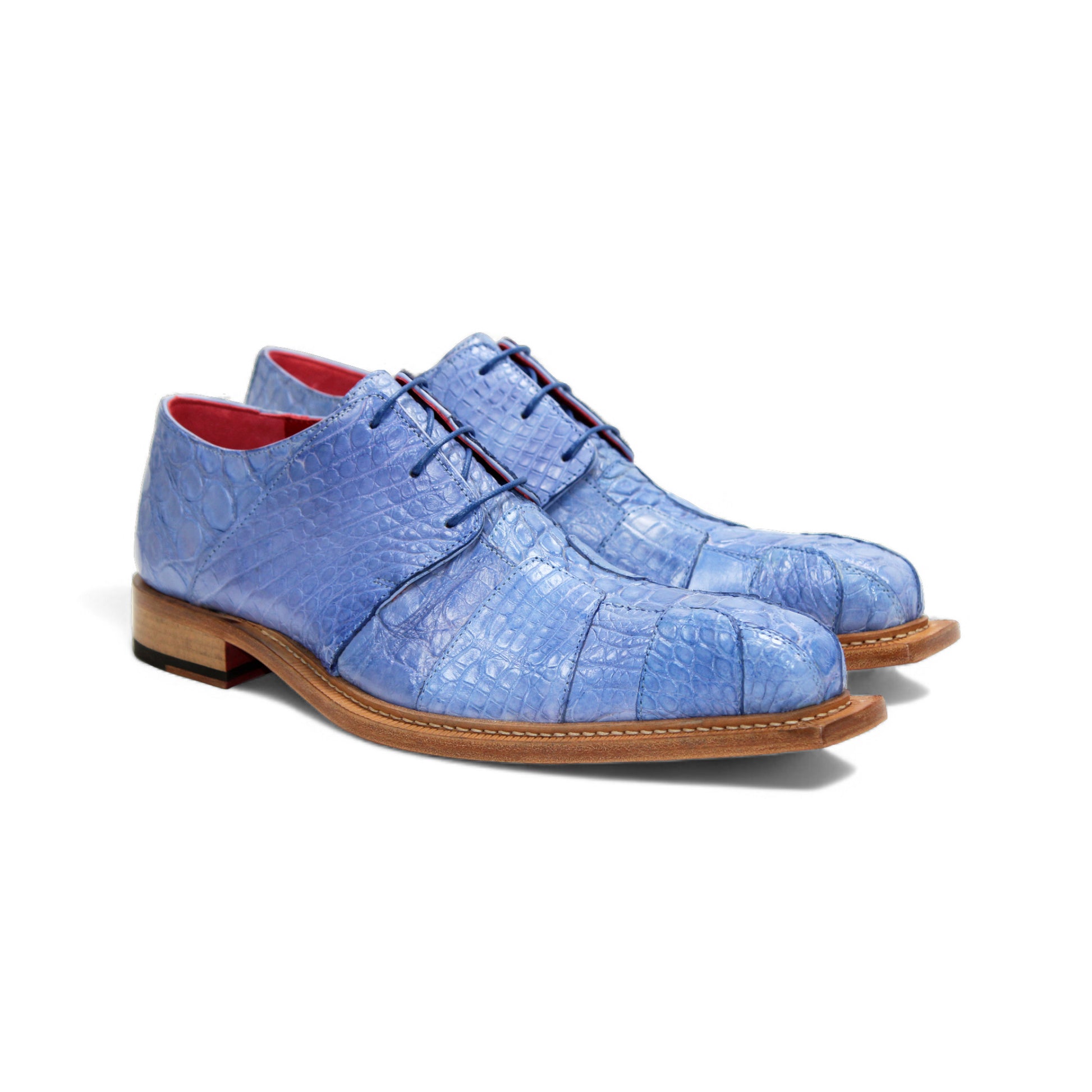 The Fennix Kingston Light Blue by Fennix of Italy is a stylish genuine alligator leather shoe with Italian craftsmanship and a wooden sole, shown from the side on a white background.