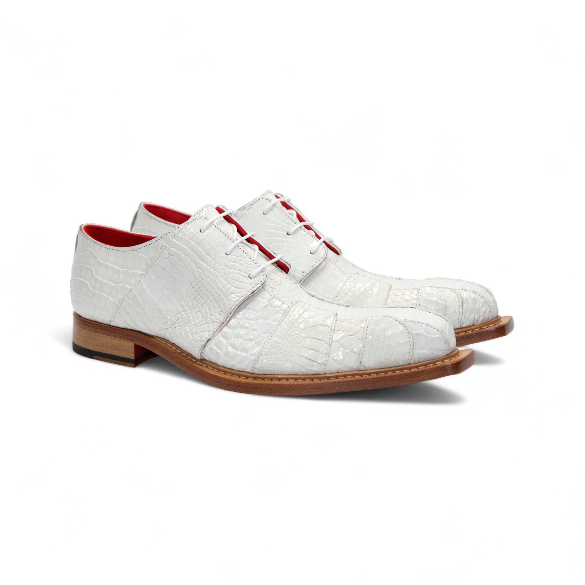 The Fennix Kingston White by Fennix of Italy is a stylish shoe made from genuine alligator leather, with a white crocodile pattern, red interior lining, lace-up closure, and brown sole—displayed in side profile on a white background.
