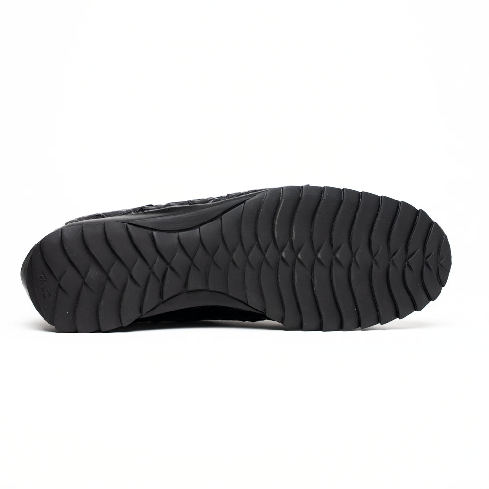 The Kratos Black by Marco Di Milano is a luxury black crocodile-patterned leather dress shoe, featuring a metal logo on the laces. Displayed with one upright and one on its side to showcase the detailed sole.