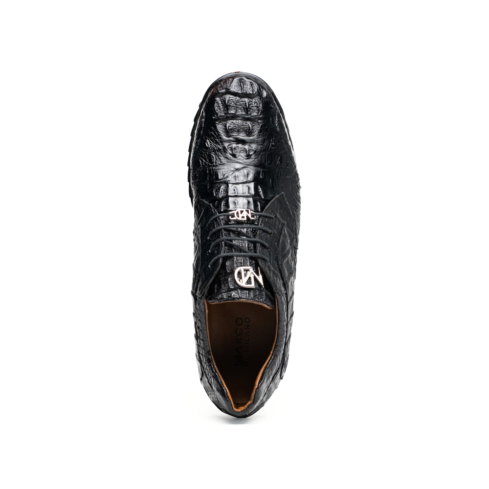 The Kratos Black by Marco Di Milano is a luxury black crocodile-patterned leather dress shoe, featuring a metal logo on the laces. Displayed with one upright and one on its side to showcase the detailed sole.