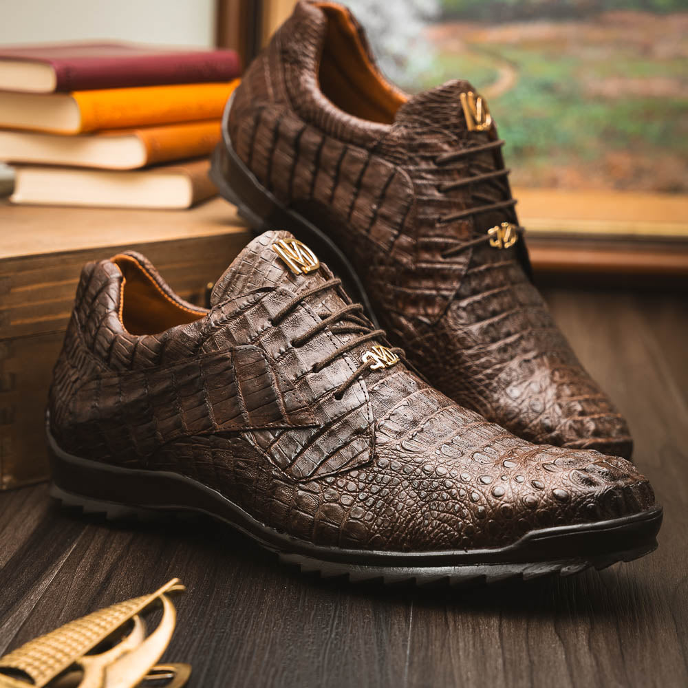 The Kratos Brown by Marco Di Milano features genuine caiman crocodile leather, a hand-painted brown finish, black soles, and gold lace accents—ideal luxury dress shoes for the discerning wearer.