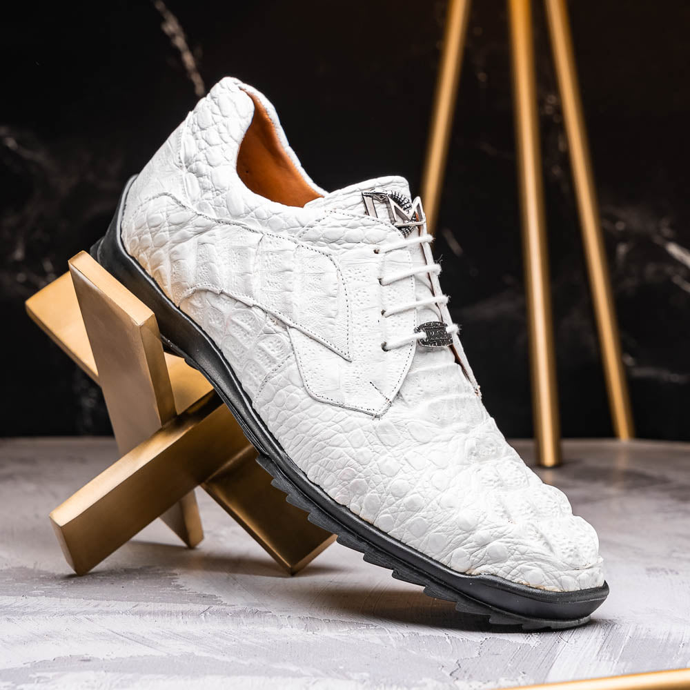 Kratos White by Marco Di Milano: luxury white crocodile-patterned leather dress shoes with black rubber soles—one upright, the other on its side.
