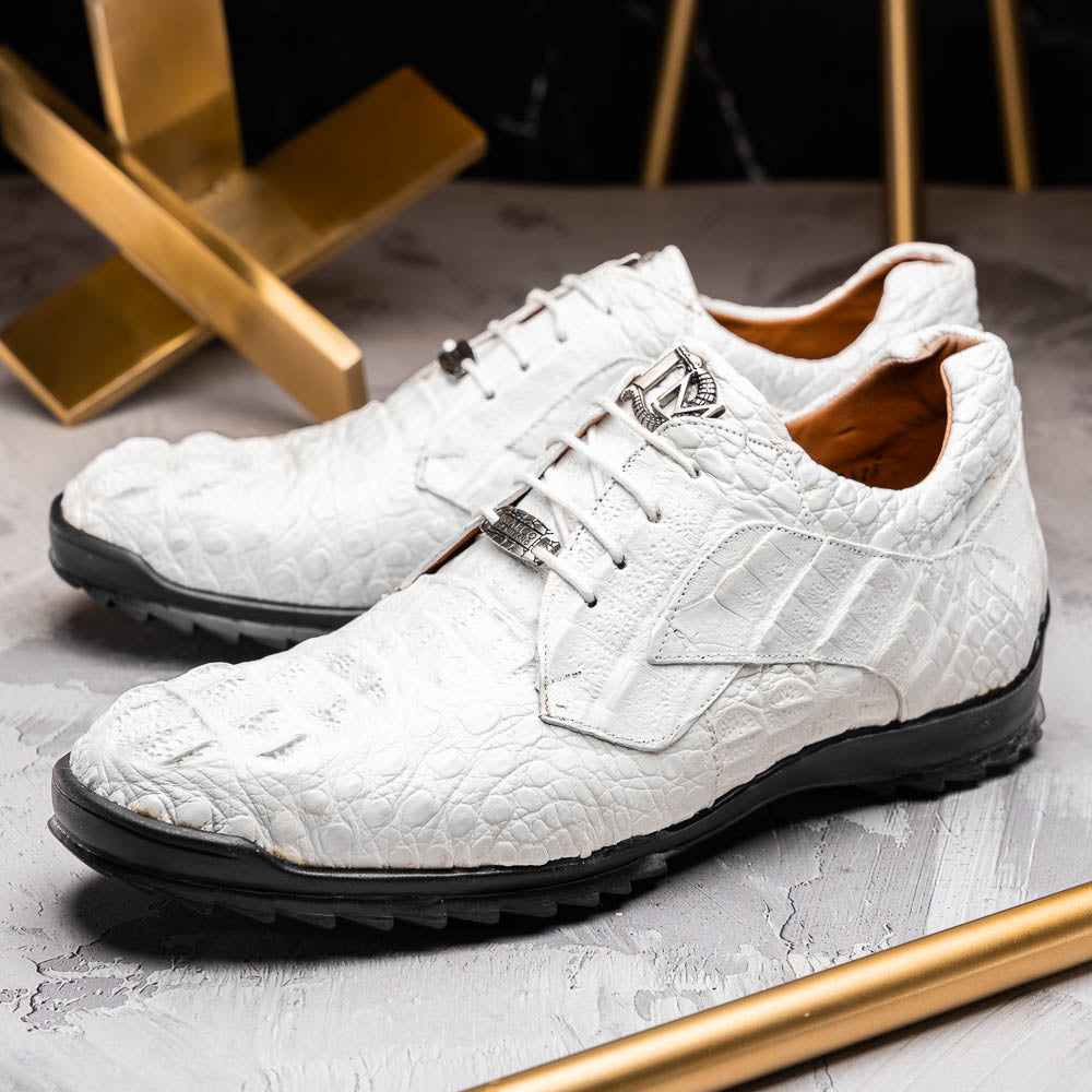 Kratos White by Marco Di Milano: luxury white crocodile-patterned leather dress shoes with black rubber soles—one upright, the other on its side.