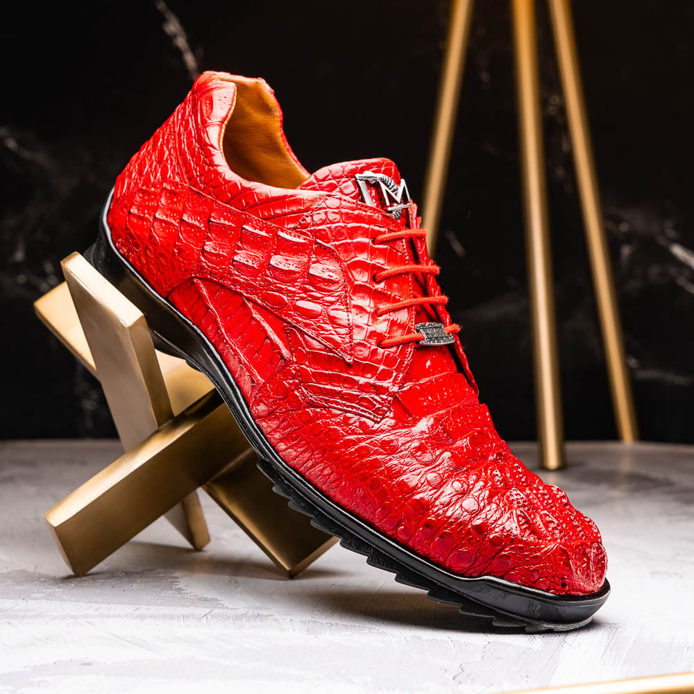 The Kratos Red by Marco Di Milano: luxury red crocodile-pattern leather dress shoes with black soles; one shoe stands upright while the other displays its polished sole.