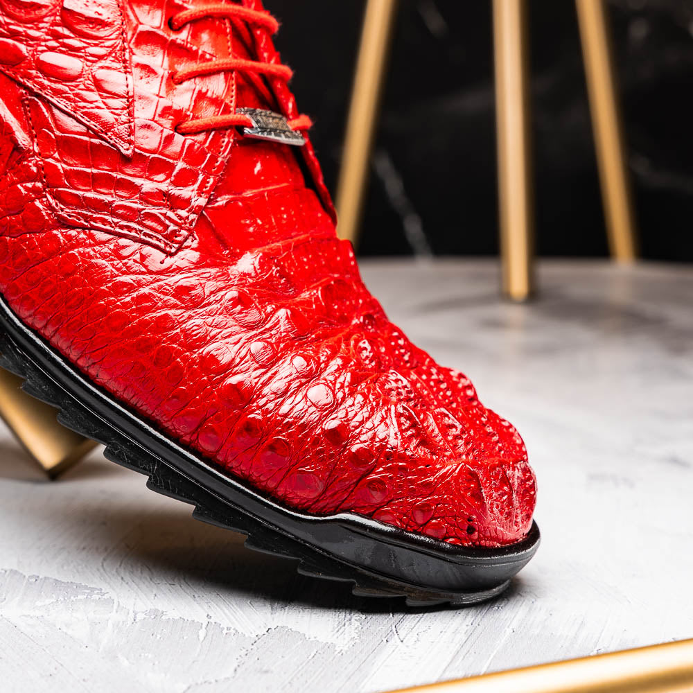 The Kratos Red by Marco Di Milano: luxury red crocodile-pattern leather dress shoes with black soles; one shoe stands upright while the other displays its polished sole.