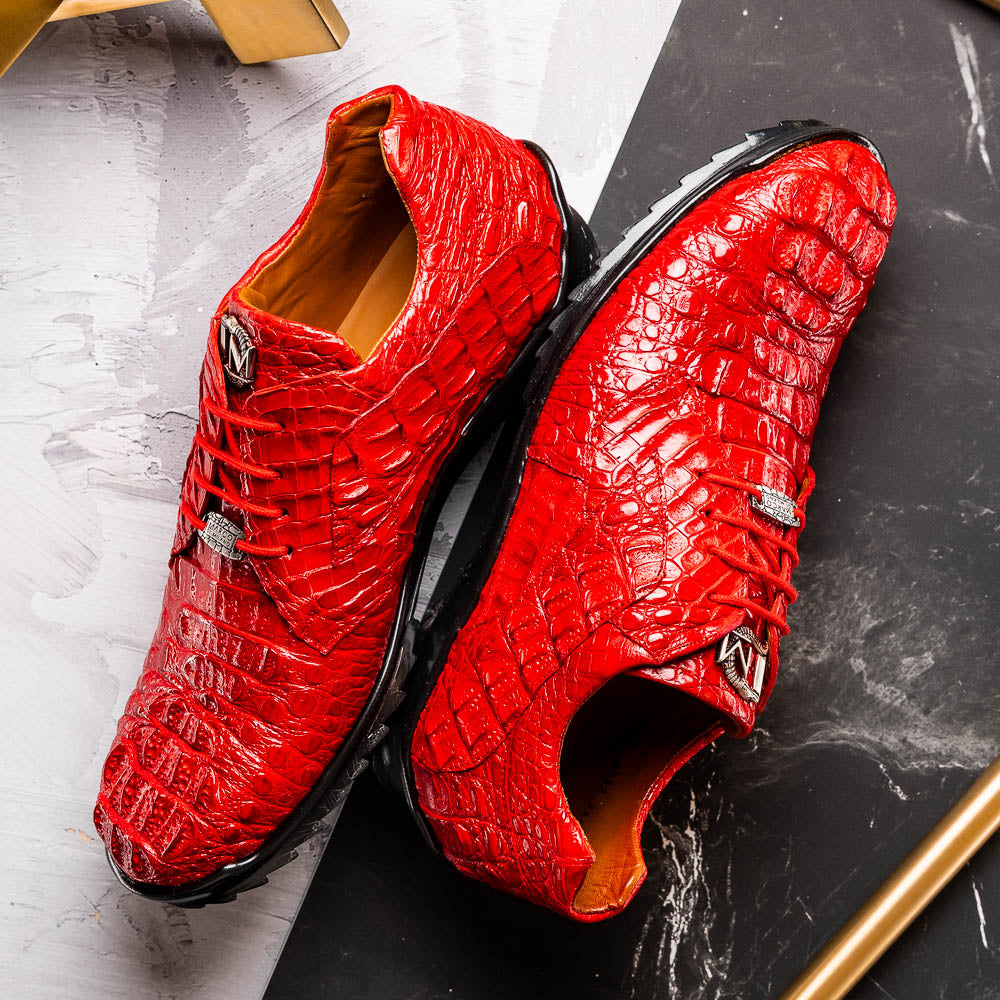 The Kratos Red by Marco Di Milano: luxury red crocodile-pattern leather dress shoes with black soles; one shoe stands upright while the other displays its polished sole.