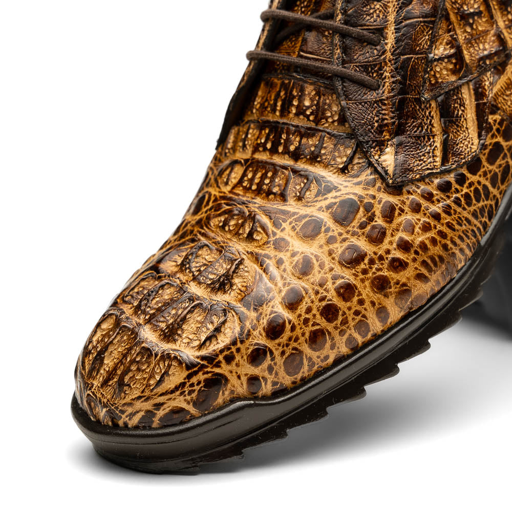A pair of Kratos Rustic Orix brown crocodile-patterned leather dress shoes by Marco Di Milano, one upright and one tilted to display the textured sole, showcasing luxury footwear against a white background.