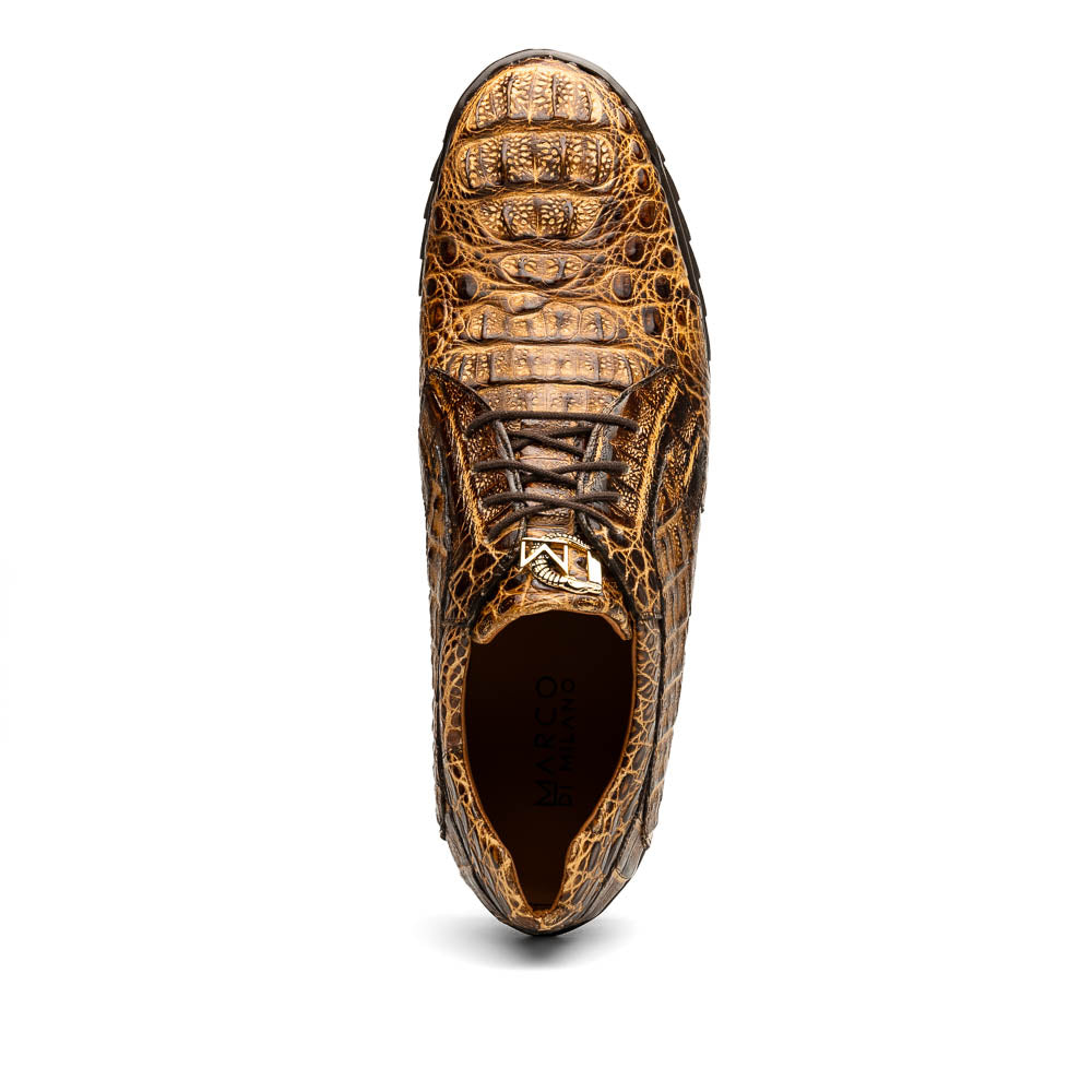 A pair of Kratos Rustic Orix brown crocodile-patterned leather dress shoes by Marco Di Milano, one upright and one tilted to display the textured sole, showcasing luxury footwear against a white background.