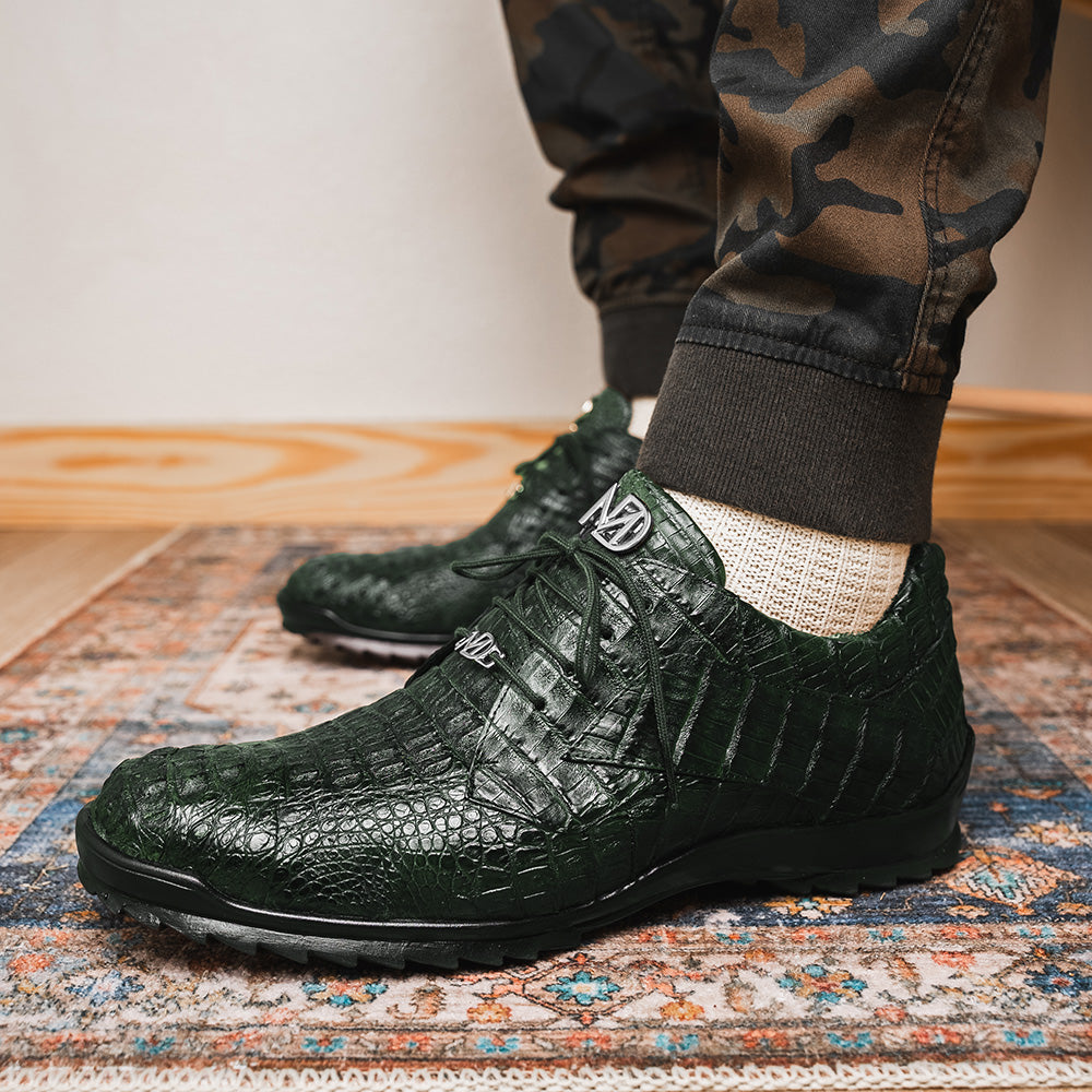The Kratos Green by Marco Di Milano are dark green lace-up shoes crafted from textured leather with a crocodile skin pattern, black rubber soles, and a hand-painted finish for luxurious sophistication.