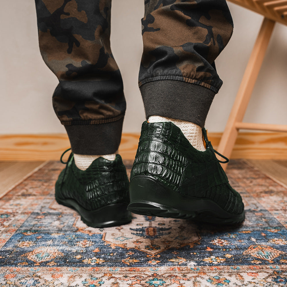 The Kratos Green by Marco Di Milano are dark green lace-up shoes crafted from textured leather with a crocodile skin pattern, black rubber soles, and a hand-painted finish for luxurious sophistication.
