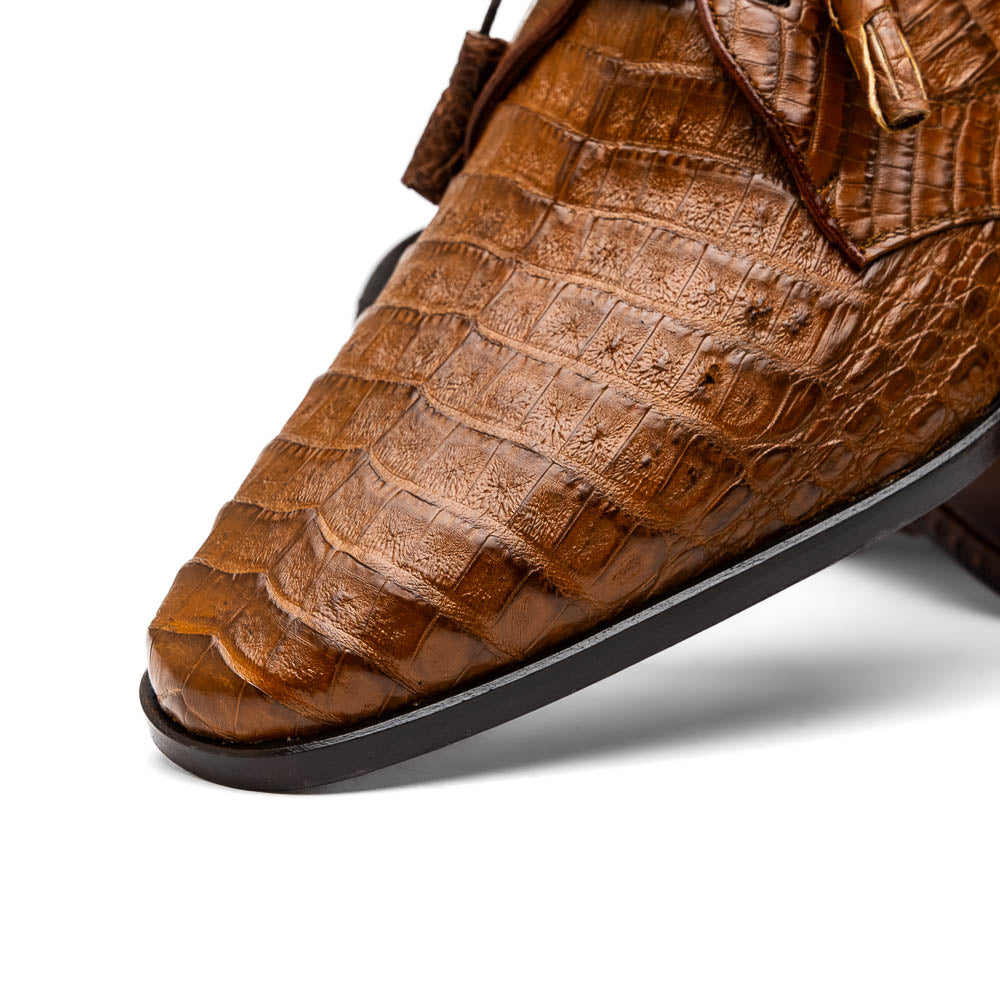 A pair of Marco Di Milano Lacio Bay Apache luxury derby shoes crafted from genuine caiman crocodile leather—one upright and the other on its side to showcase the exquisite sole.