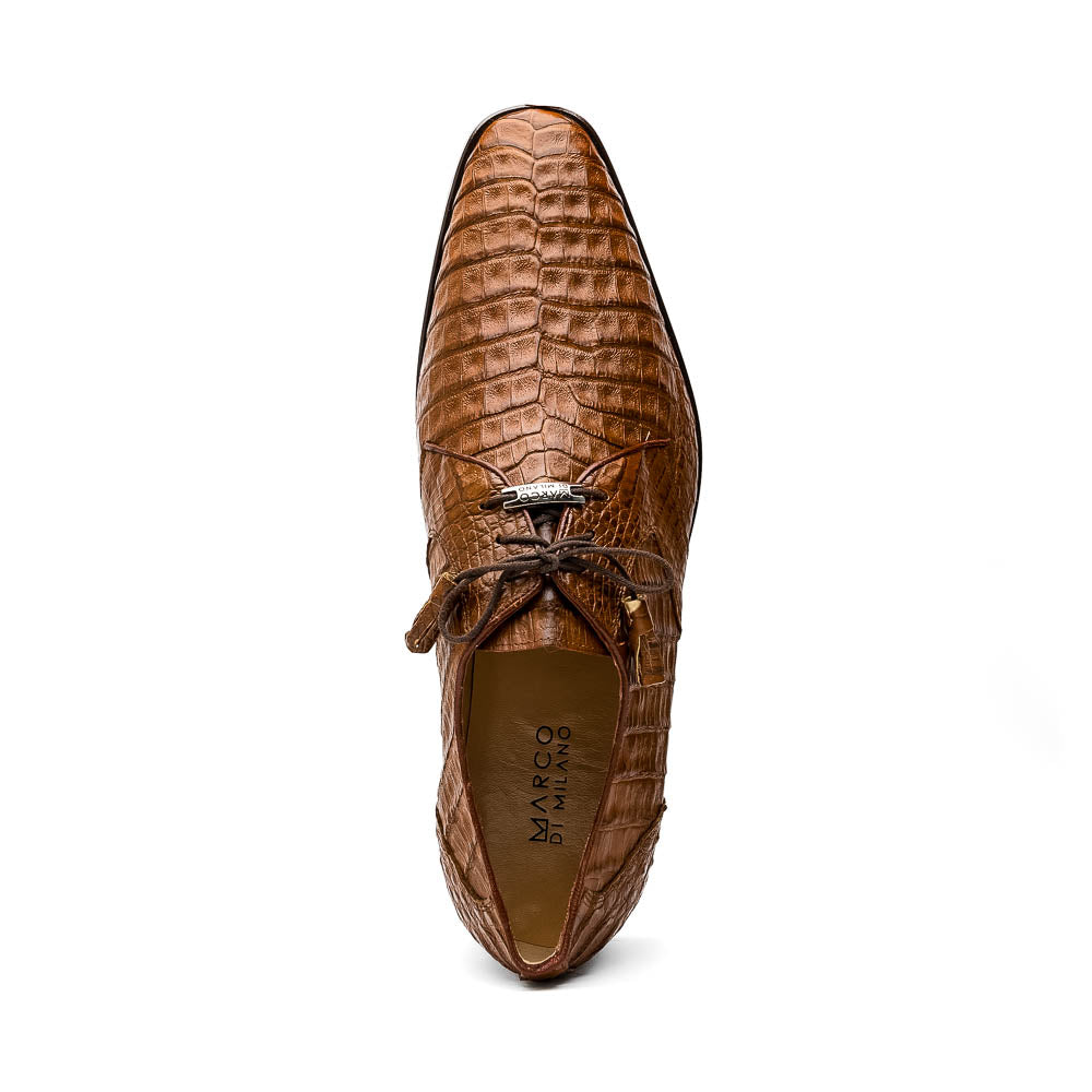 A pair of Marco Di Milano Lacio Bay Apache luxury derby shoes crafted from genuine caiman crocodile leather—one upright and the other on its side to showcase the exquisite sole.