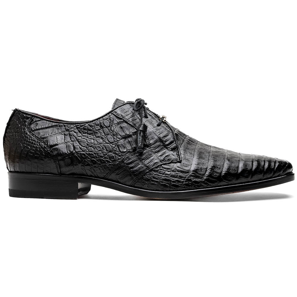 A pair of Marco Di Milano Lacio Black shoes—crafted from genuine caiman crocodile leather—one upright and one on its side, showing a brown leather sole embossed with luxury branding.