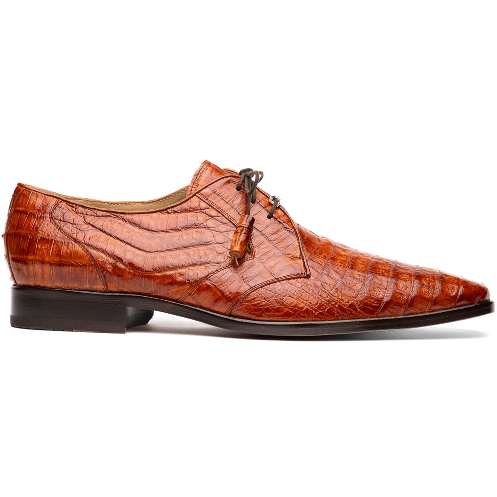 A pair of Marco Di Milano Lacio Brandy luxury derby shoes in a brown crocodile pattern, crafted from genuine caiman leather—one upright and one on its side to highlight the signature sole branding.